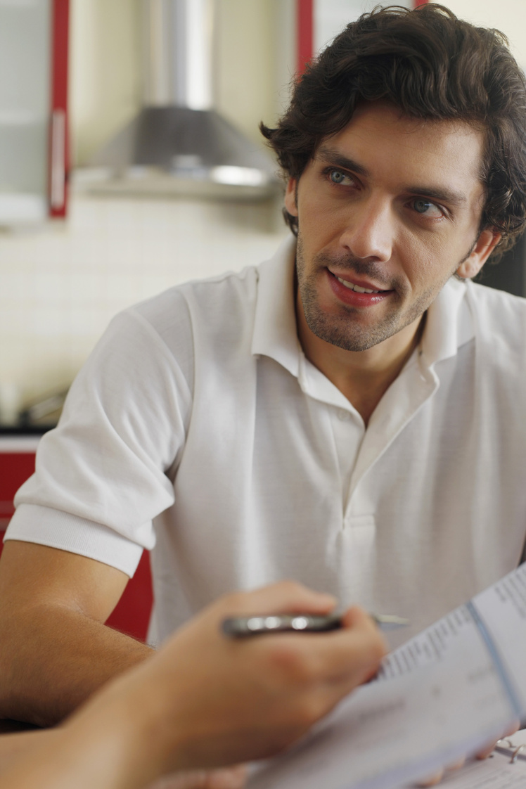 Man and woman sorting out bills together